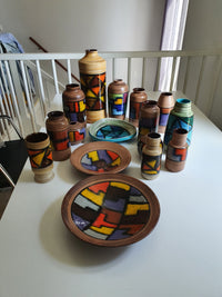 Mid-century pattern Vetrata vases and bowls by Aldo Londi for Bitossi Italy. Black, blue, orange and yellow on a brushed background.