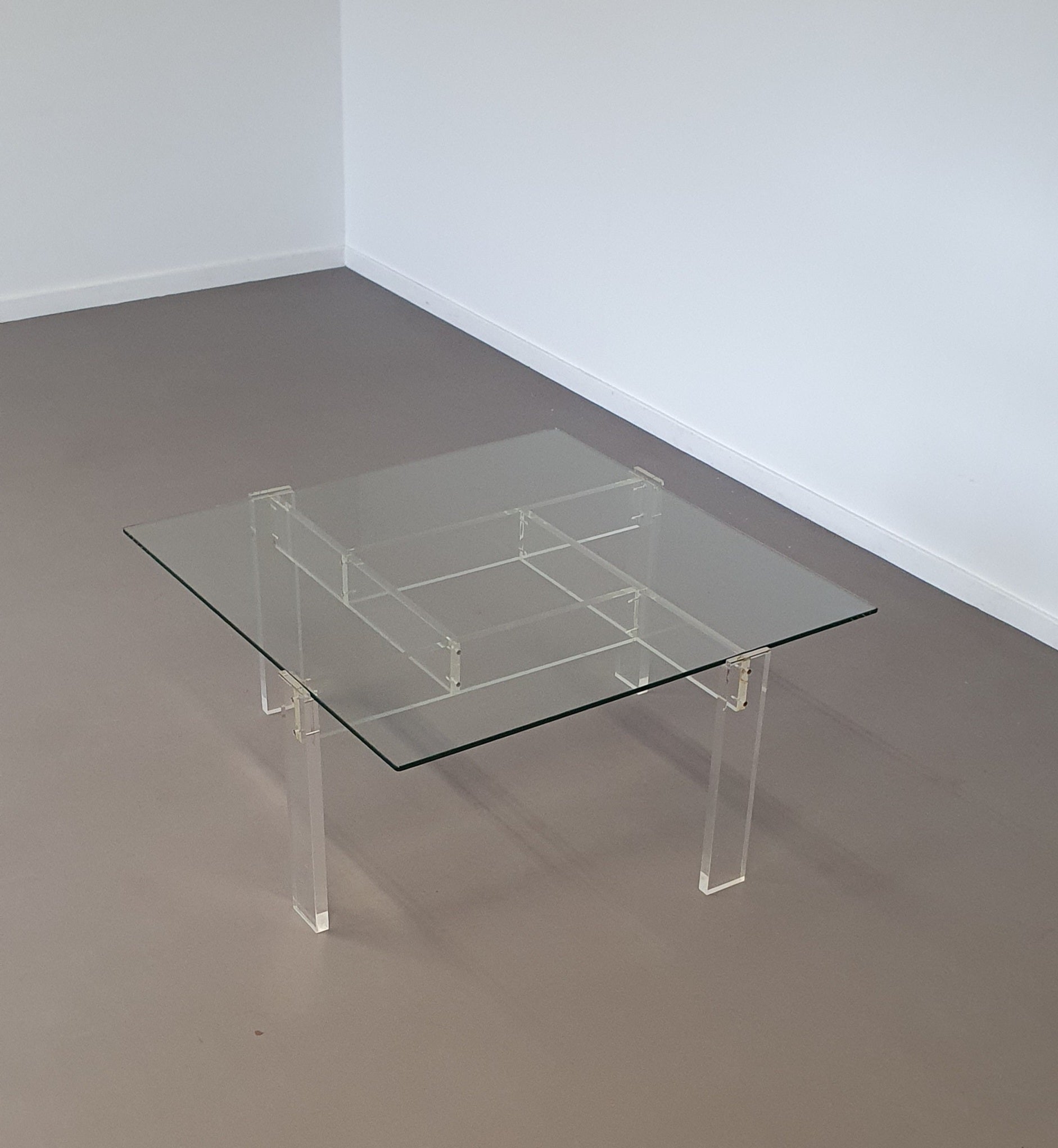 Vintage coffee table made by de Swart. Made of acrylic glass with a glass top